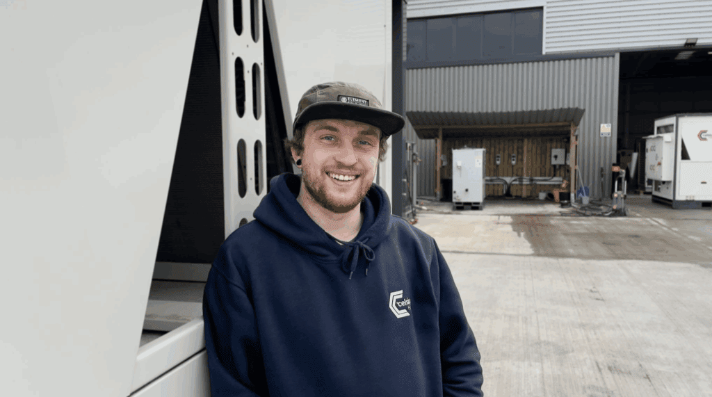 engineer at Celsius Hire wearing a cap standing outside the office