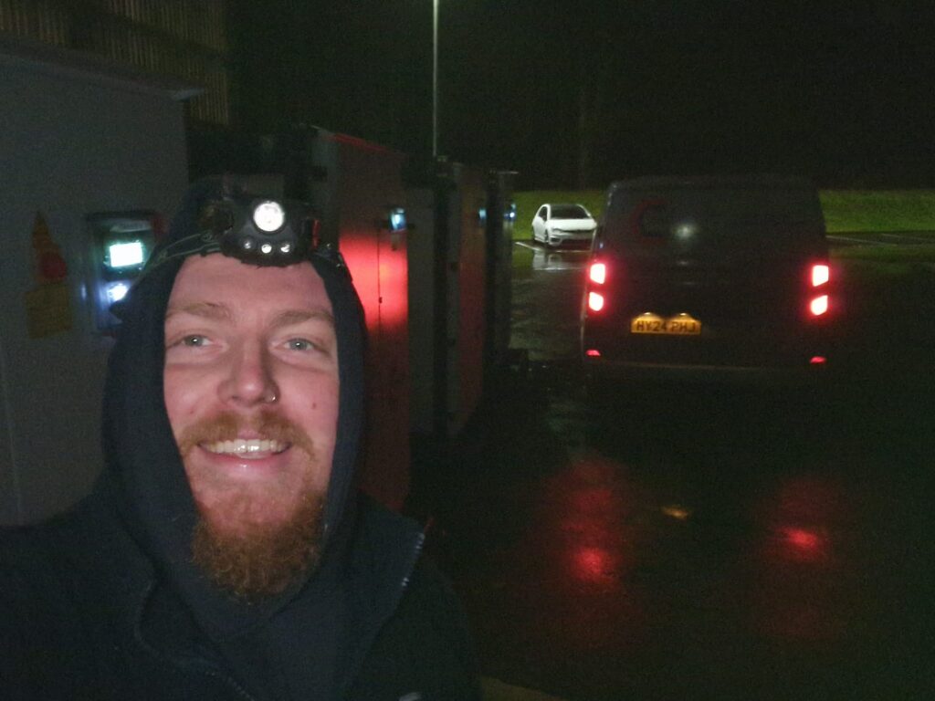Curtis working at night taking a selfie whilst on site